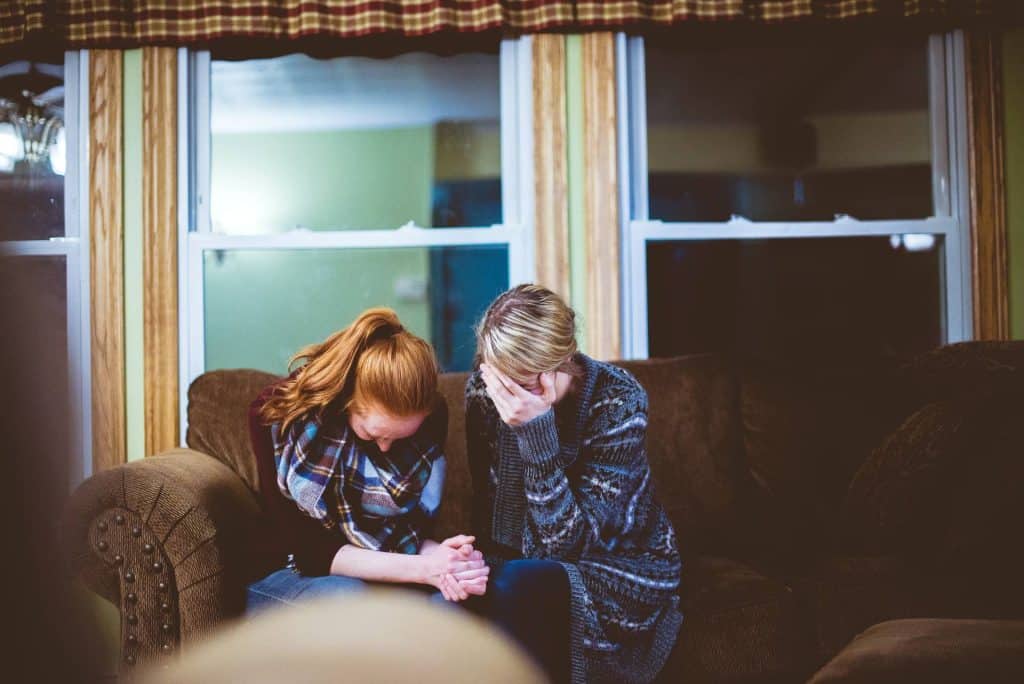 two girls praying